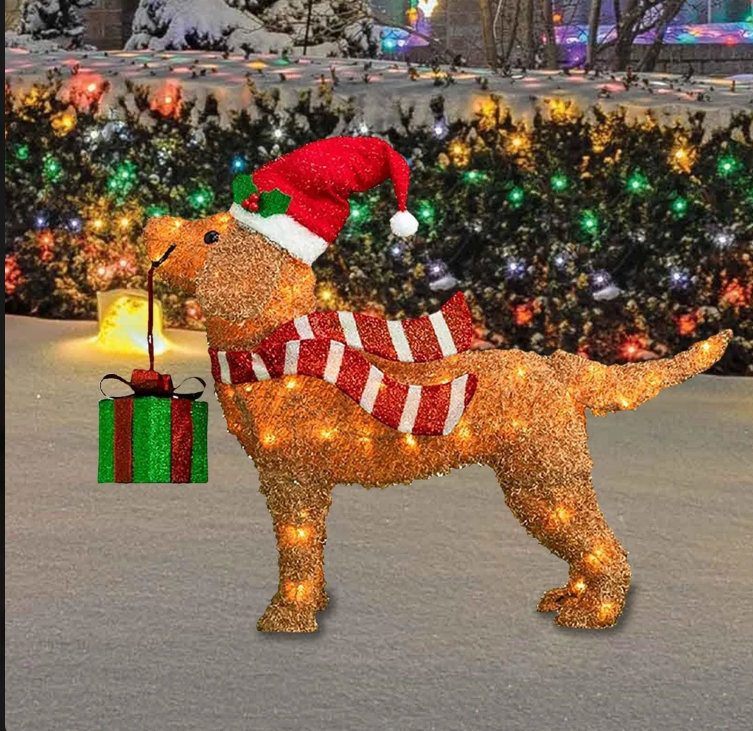 Golden retriever Christmas outdoor ornament wearing a Santa hat and red scarf, holding a gift and decorated with lights