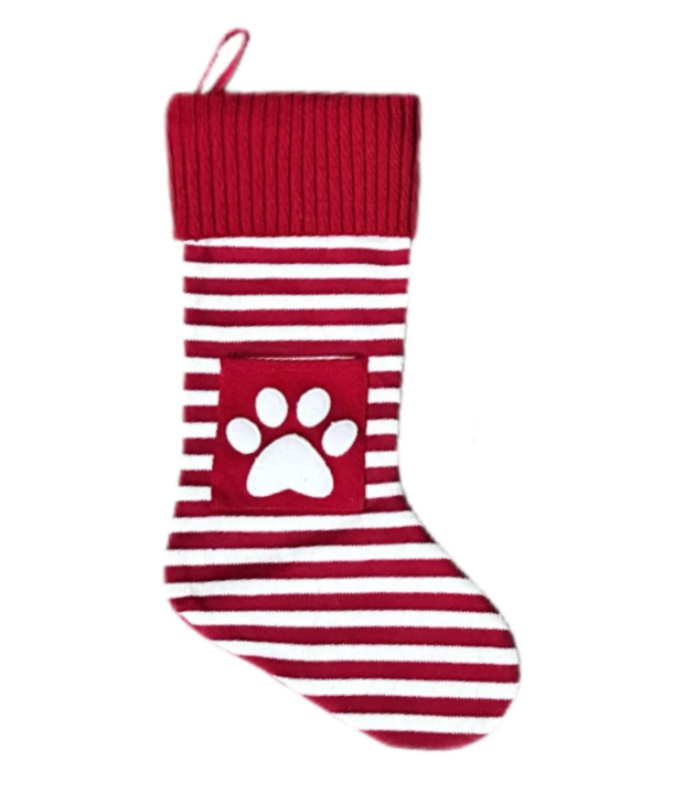 Red and white striped knitted Christmas stocking with paw print pocket
